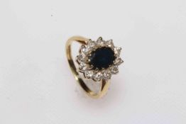 Sapphire and diamond cluster 18 carat gold ring, size L/M.