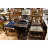 Antique jointed gateleg dining table and four rush seated country dining chairs.