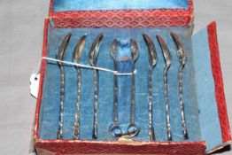 Boxed set of Chinese silver teaspoons and tongs.