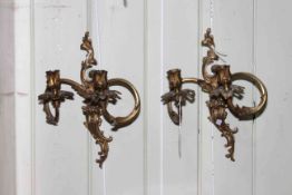Pair of ornate two branch wall sconces.