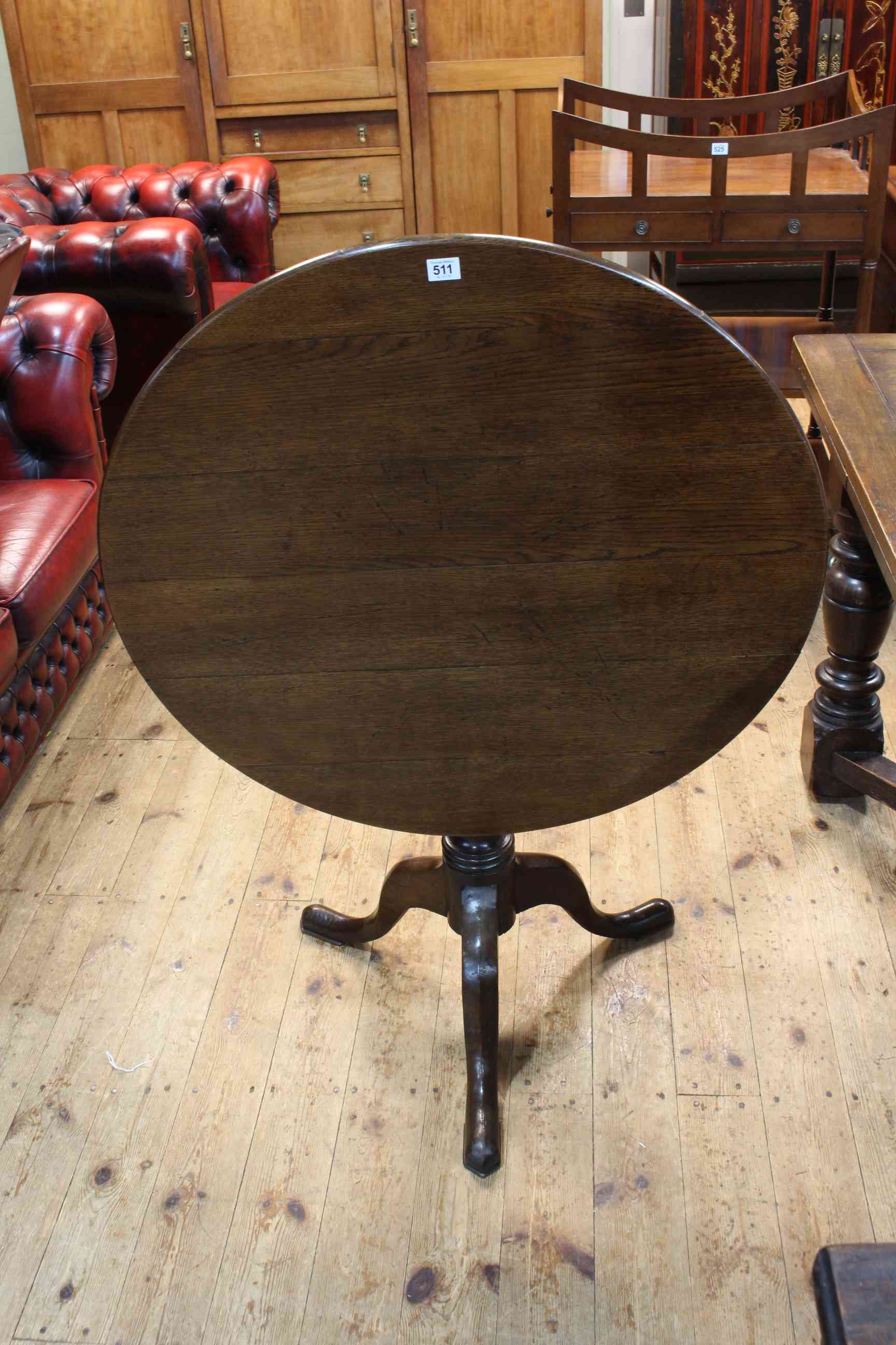 19th Century oak snap top supper table on tripod base, 72cm x 82cm diameter.