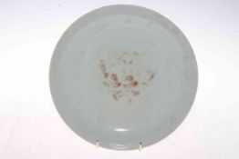 Chinese saucer dish with outer yellow ground with slight relief dragon decoration, 22.5cm diameter.