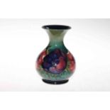 Moorcroft vase decorated with anemone on green ground, 15cm.