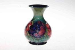 Moorcroft vase decorated with anemone on green ground, 15cm.