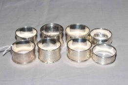 Collection of eight silver napkin rings.