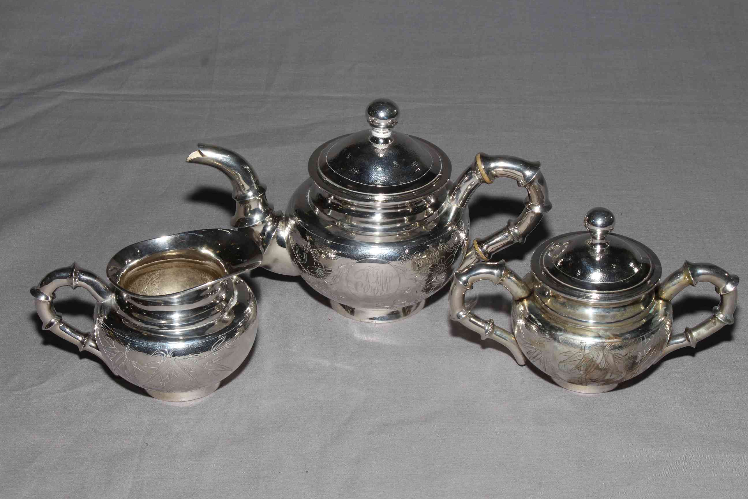 Chinese Shanghai silver four piece tea set comprising teapot, sugar, cream and strainer,