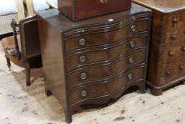 Mahogany serpentine front chest having brush slide above four long drawers on splayed legs,