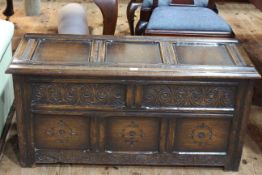 Carved oak triple panel front blanket box, 52cm x 106cm x 44cm.