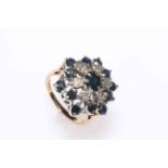 Sapphire and diamond cluster 9 carat gold ring, size M/N.