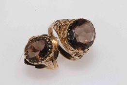Two 9 carat gold quartz rings with fancy settings.