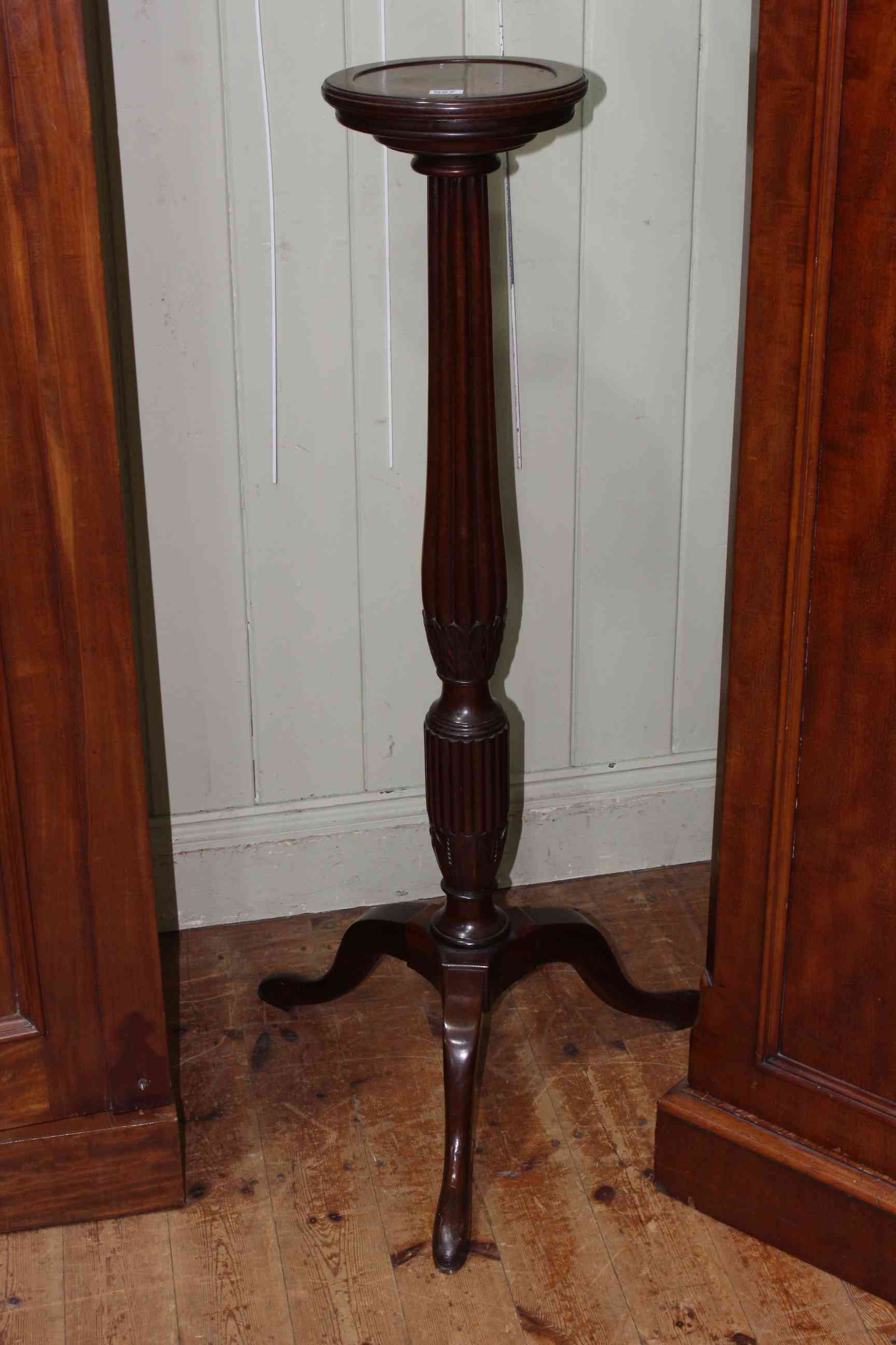 Mahogany fluted column torchere on tripod base, 119cm.