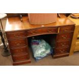 Mahogany inverted bow front nine drawer pedestal desk, 77cm x 117cm x 58.5cm.