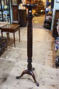 Mahogany twist and carved column tripod torchere on ball and claw feet, 153cm.