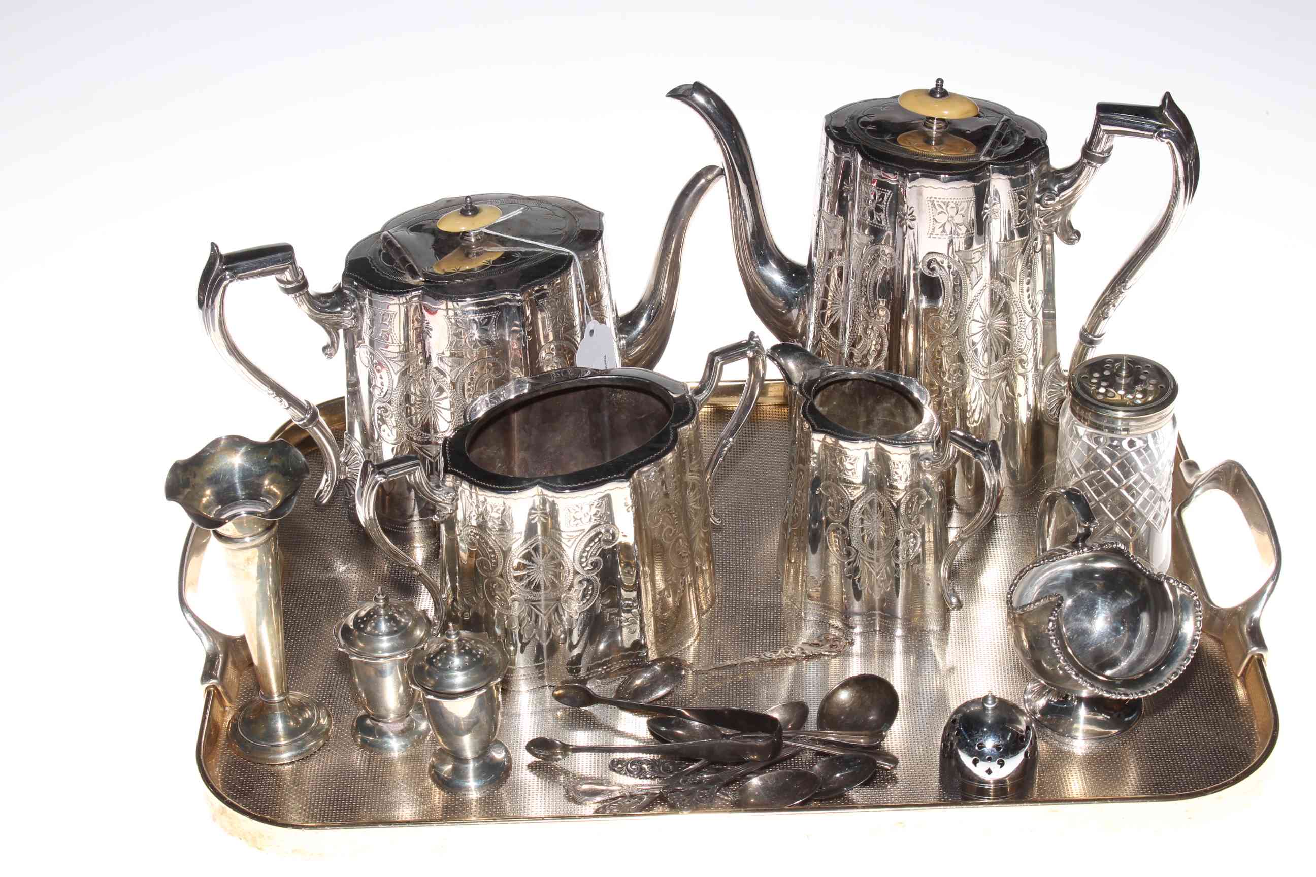 Four piece silver plated tea set, silver spill vase and pair pepperettes, silver and other spoons,