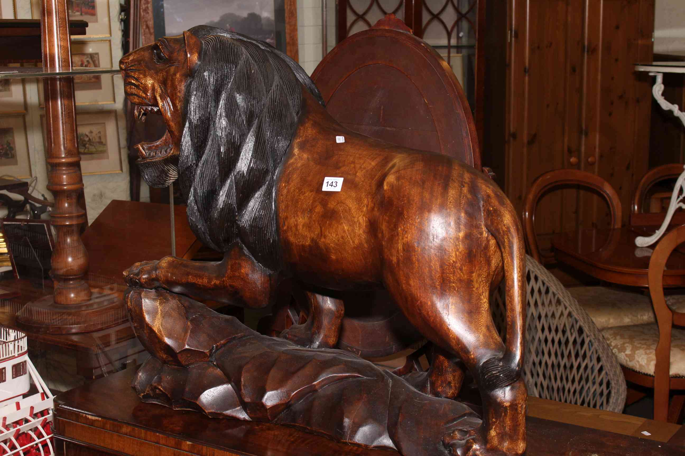 Large ornate carved lion model, 65cm by 72cm by 30cm.