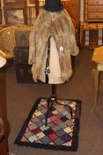 Vintage dress maker's dummy, fur coat, bowler hat, clippy rug, quilt and bed covers.