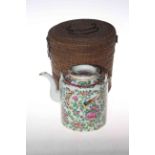 Cantonese teapot with famille rose, bird and insect decoration together with wicker carry case.