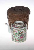 Cantonese teapot with famille rose, bird and insect decoration together with wicker carry case.