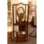 Early 20th Century oak oval mirror backed hallstand, 189cm.