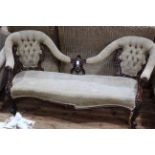 Victorian mahogany double button backed settee with serpentine front seat.