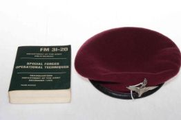 Parachute Regiment cap and Special Forces Operational Techniques manual.
