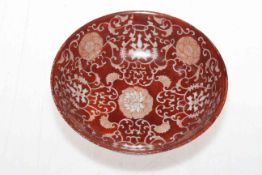 Chinese red ground patterned bowl, blue seal and two circle mark, 15cm diameter.
