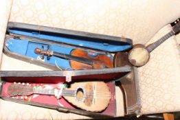 Cased violin and bow, cased mandolin, banjo and zither.