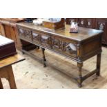 Oak Jacobean style three drawer dresser on turned legs, 82cm by 204cm by 56cm.