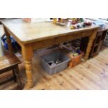 Pine two drawer farmhouse style kitchen table on turned legs, 77cm by 142cm by 106cm.