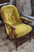 Victorian mahogany open armchair on turned legs.
