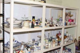 Two full shelf lots of porcelain including figurines, plates, Hornsea Saffron lidded jars, dolls,