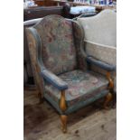 Tapestry wing open armchair on cabriole legs.