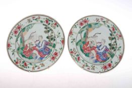 Pair antique Chinese famille rose plates decorated with female European scenes, 23cm diameter.