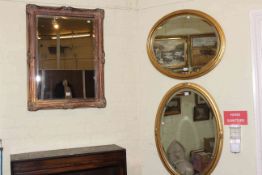 Rectangular gilt framed bevelled wall mirror and two oval gilt framed bevelled wall mirrors (3).