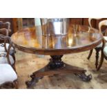 Victorian circular rosewood loo table on carved pedestal to inverted triform base,