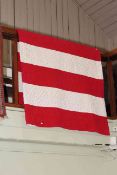 Red and white striped Durham quilt.