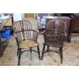 Two similar Antique Windsor pierced splat back elbow chairs with crinoline stretchers.