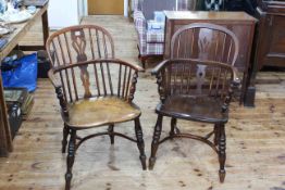 Two similar Antique Windsor pierced splat back elbow chairs with crinoline stretchers.