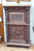 19th Century carved oak cabinet having lion mask drawer above two cupboard doors,