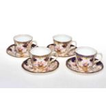 Set of four Royal Crown Derby cups and saucers.