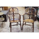 Two similar Antique Windsor pierced splat back elbow chairs.