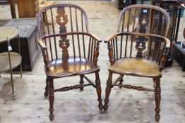 Two similar Antique Windsor pierced splat back elbow chairs.