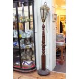 Brass lantern topped turned and carved column lamp.