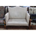 Edwardian arched back settee on cabriole legs.