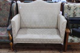 Edwardian arched back settee on cabriole legs.