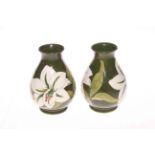 Pair Moorcroft Pottery Bermuda Green Lily pattern vases, 14cm high.