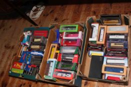 Three boxes of assorted models of buses.