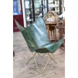 Modernist green leather chair.