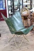 Modernist green leather chair.