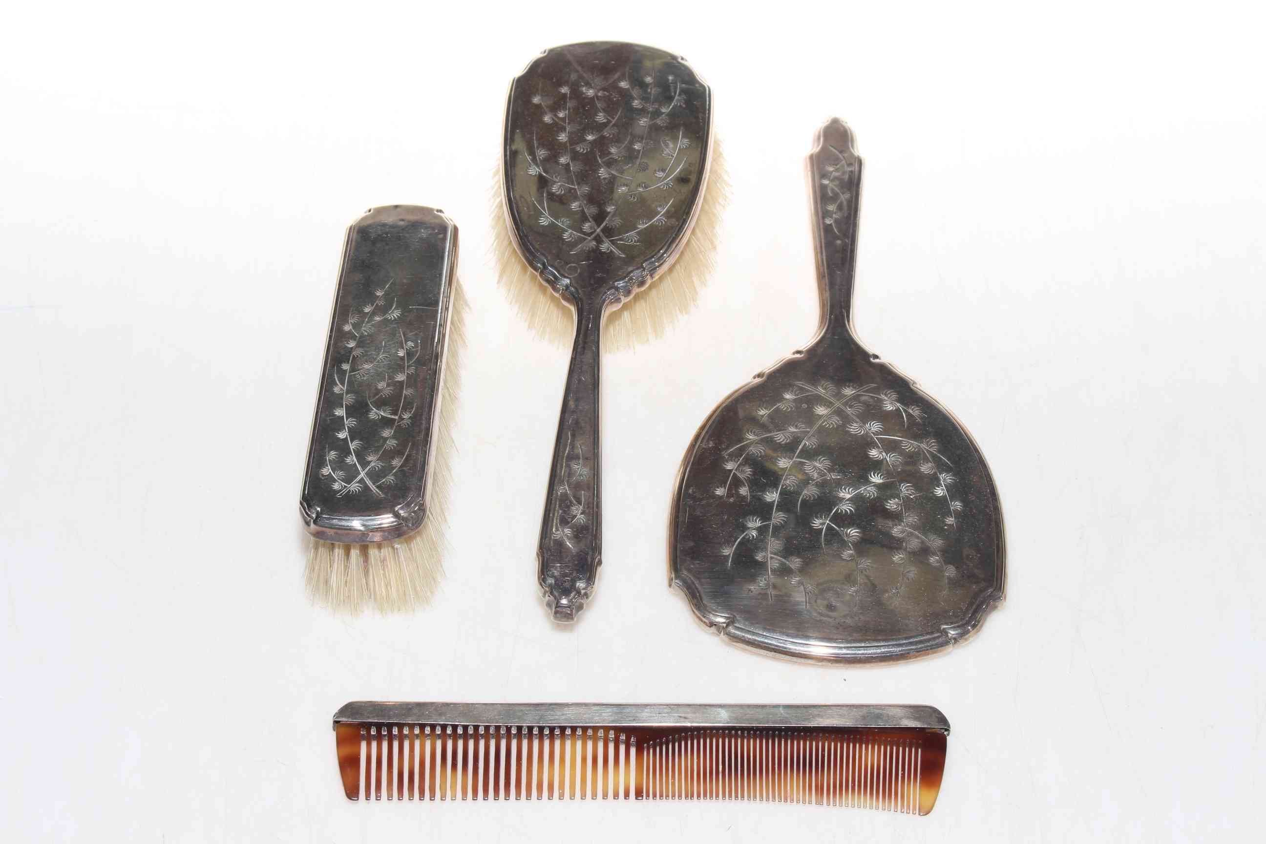 Silver four piece brush and mirror set, Birmingham 1977.